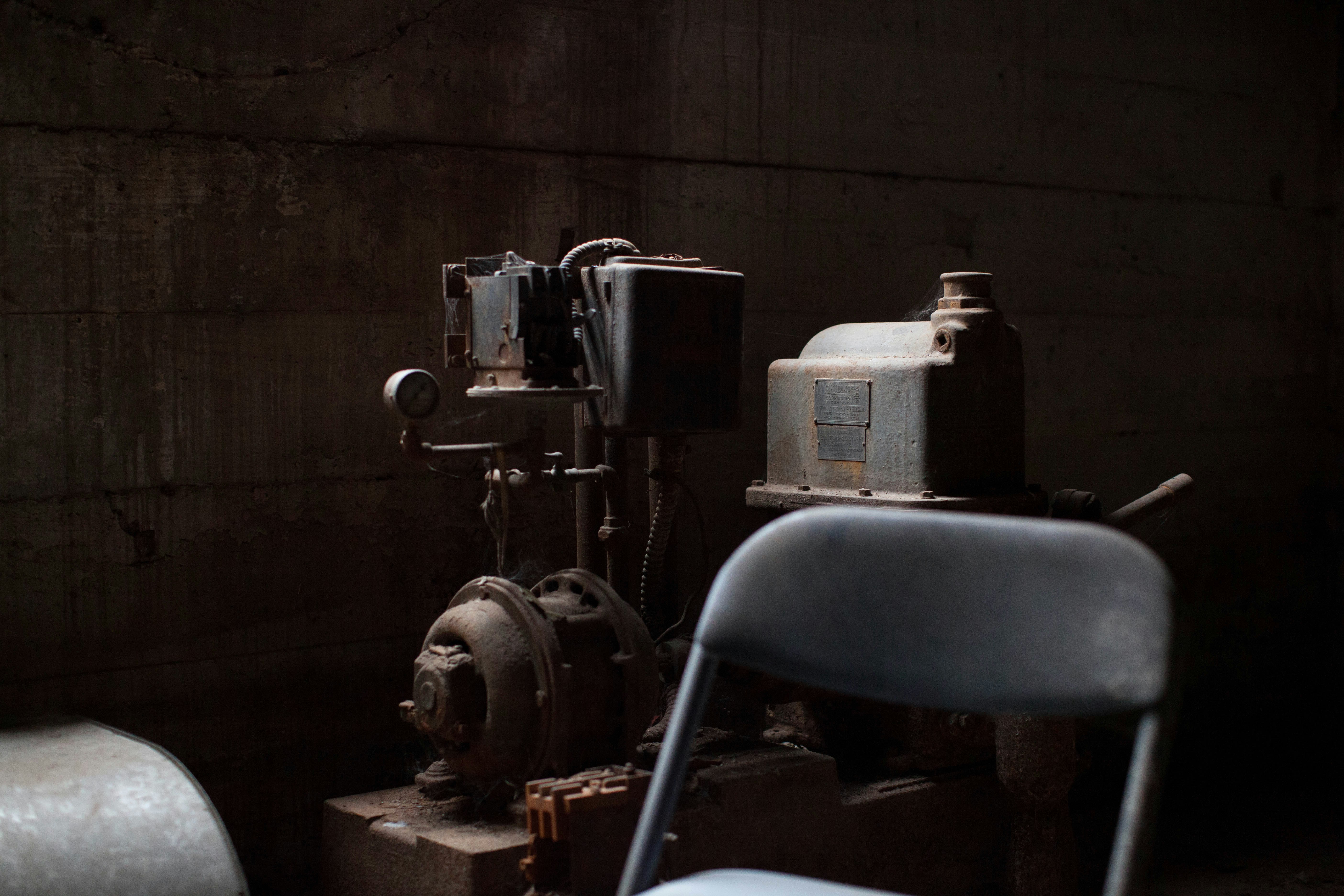 AC motor-powered machine behind chair